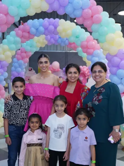 A group of friends and family pose for a photo, celebrating a special day. The joy and camaraderie are what make parties at Wobble World so special.