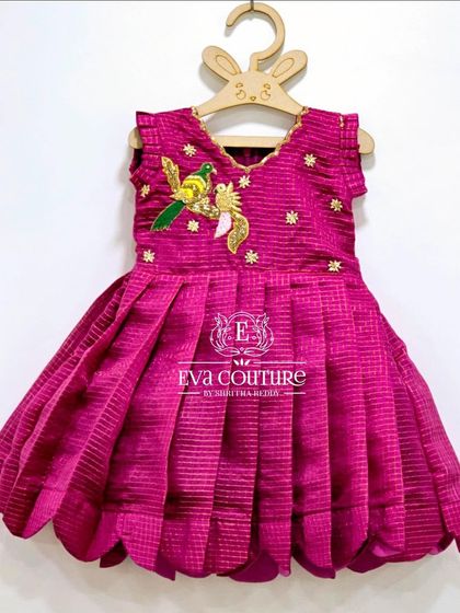 This magenta frock with bird embroidery is ready to dispatch in newborn to 1-year sizes. All colors can also be customized for a new order.