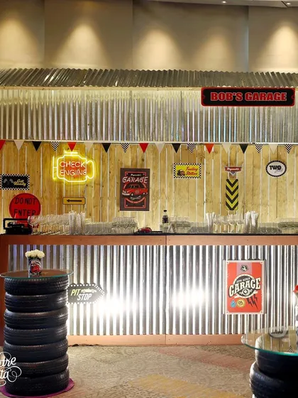 Another view of the impressive 'Bob's Garage' bar setup, with tables made from stacked tires.