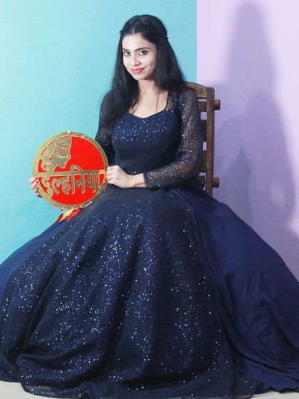 Our "Dulhaniya" prop adds a fun touch to this beautiful navy gown, making it great for a bridal shower or pre-wedding party.