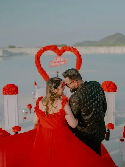 A romantic look back before the big moment. The scale of the proposal setup against the vast landscape makes this a truly epic pre-wedding shot.