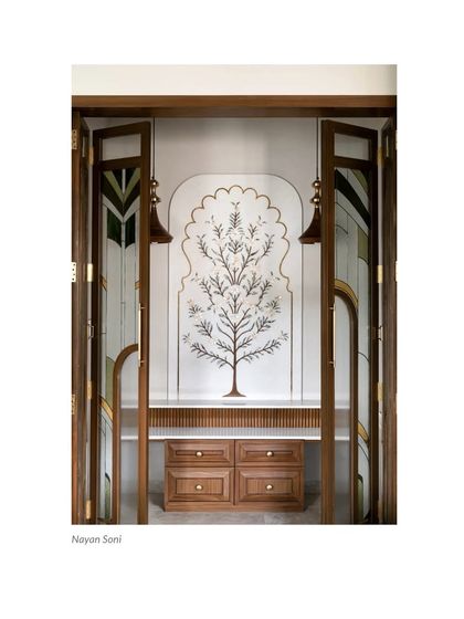 A press clipping of our custom Puja Room, recognized for its beautiful marble inlay work and artisanal glass and wood shutters.