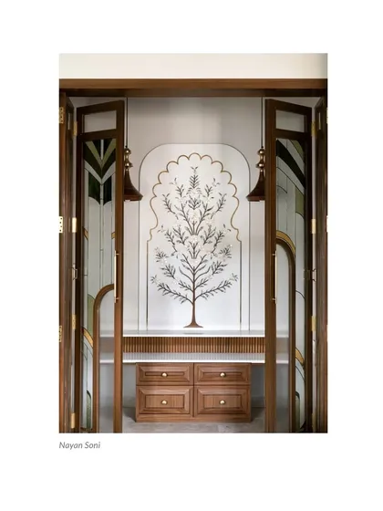 A press clipping of our custom Puja Room, recognized for its beautiful marble inlay work and artisanal glass and wood shutters.