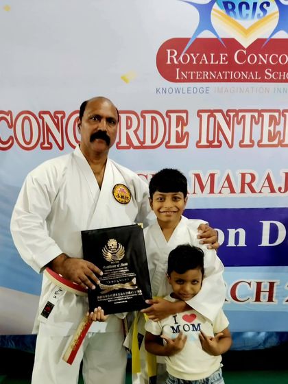 A proud moment with two young students after their colour belt grading examination at Royale Concorde International School. We are honored to be a part of their development both inside and outside the classroom.