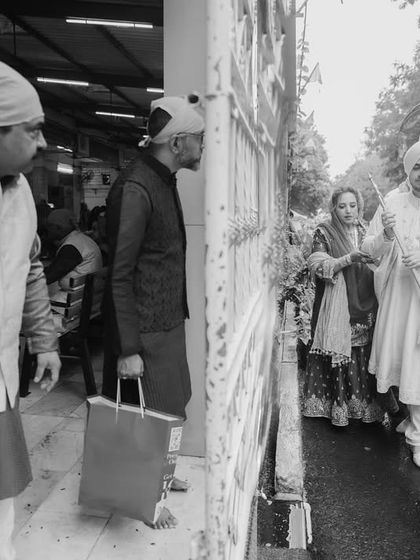 The groom and his family arriving at the Gurdwara. I document the entire journey of the wedding day, starting from these early moments.