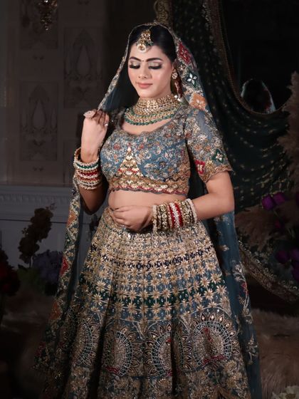 A demure pose, with the bride looking down, showcasing the beautiful eyeshadow work.