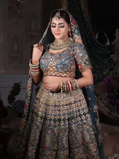 A demure pose, with the bride looking down, showcasing the beautiful eyeshadow work.