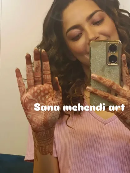 A selfie from a happy client, showing off her lovely mehndi stain. I did this design for her during a professional shoot.