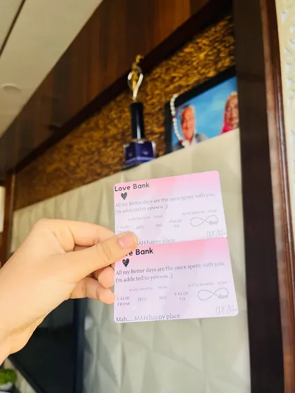Another shot of the "Love Bank" twin cards, showing the clean design and personalized details that make them a unique keepsake.