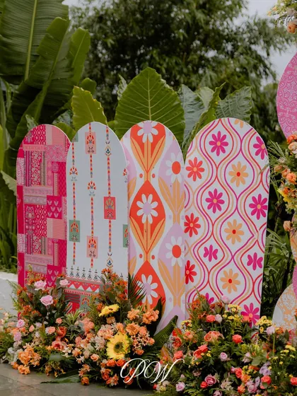 We love playing with patterns. These custom-printed backdrops with retro and block-print inspired floral designs added a unique and vibrant touch to this Haldi event.