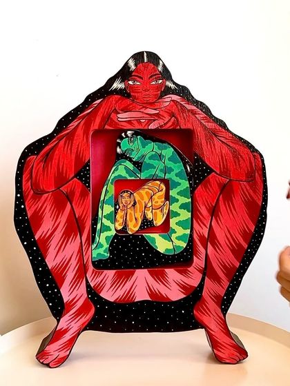 A view of the nesting figures being placed inside one another.