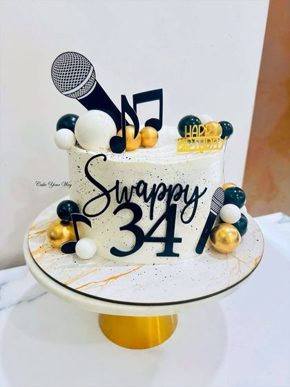 Singing "Happy Birthday" just got a little sweeter with this music-themed cake, complete with microphones and musical notes.