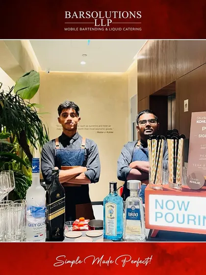 Our team at the Kohler Studio Store launch in Pune, with a lineup of premium spirits like Grey Goose and Bombay Sapphire ready to be served.