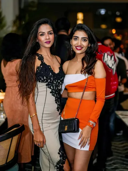 Stylish guests enjoying the themed decor and music.