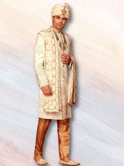 Our collection includes everything you need for the complete look. This groom's outfit includes the sherwani, churidar, safa, and dupatta, all perfectly coordinated.