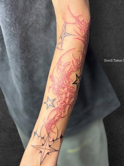 A full view of the neo-tribal sleeve, showcasing the balance between the red and black elements.