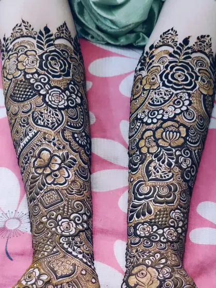 A series of shots showcasing the bridal mehndi for Tabassum. The design features bold, prominent roses that wrap around the arm.