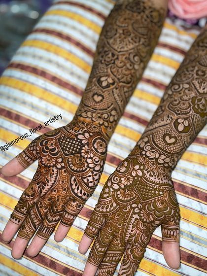 This detailed design was for an engagement bride. It features delicate hearts and intricate netting, covering the hands and arms completely for a traditional look.