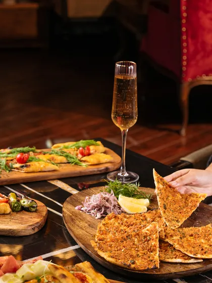 Taste your way around the world, from the savory delights of Turkish pide to the bold spices of Asia. This spread showcases the global culinary journey we offer in every meal.