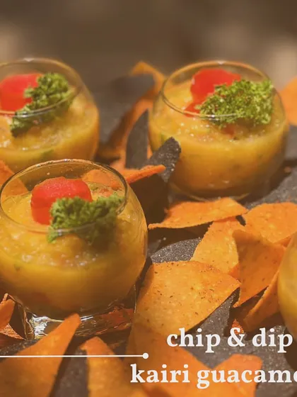 A unique twist on a classic dip. This is my Kairi Guacamole, made with raw mango for a tangy kick, served with colorful tortilla chips.