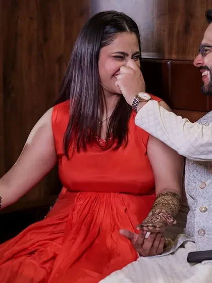 A playful, candid moment between the couple during their Mehandi. It's these little jokes and laughs that make the best memories.