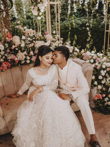 A sweet kiss from the groom, a lovely candid moment from the engagement day.