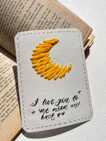 "I love you to the moon and back." A classic sentiment paired with a hand-embroidered crescent moon. Simple, sweet, and heartfelt.