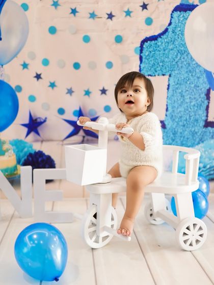 Twinkle, twinkle, little star, how loved you are. A blue and white star-themed first birthday shoot for a special little boy.