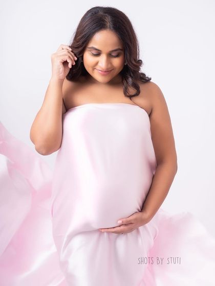 A quiet, reflective moment. Even in a studio setting, we can create images that feel intimate and personal, focusing on the connection between you and your baby.