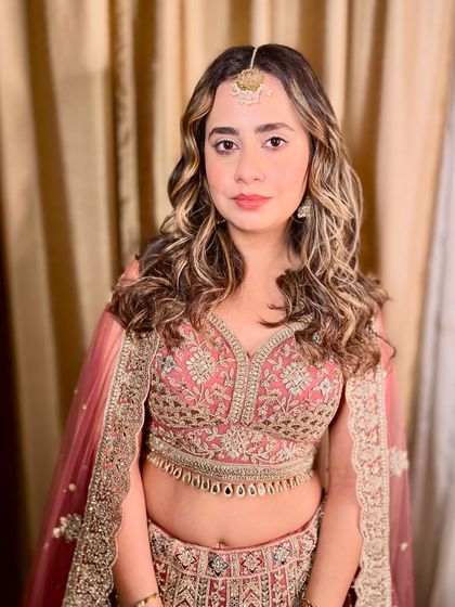 A close-up portrait, showing the subtle makeup that enhances her features without looking heavy.