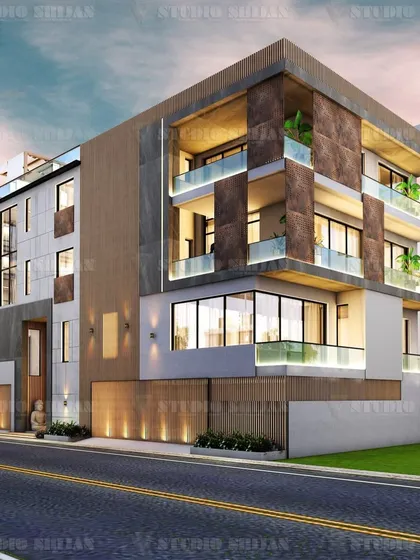 A dusk render of the Shalimar Bagh project, showing how exterior lighting highlights the rich textures of the stone and wood cladding. The design balances solid masses with transparent glass for a layered effect.