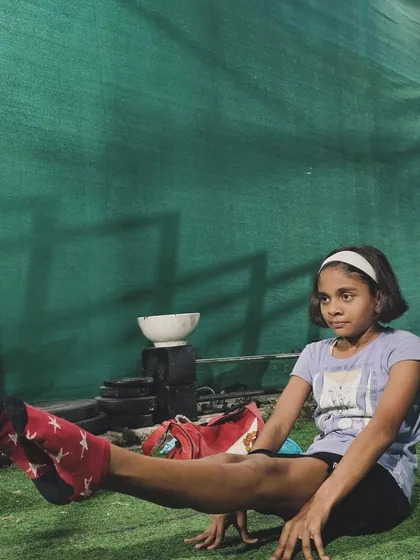 Building a strong core is key to all advanced movements. Here, one of our young members works on her L-sit, showing the concentration it takes to succeed.