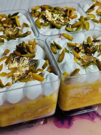 These are my Kesar Pista Tres Leches Cups, made specially for Rakhi. Each cup has a moist, saffron-infused sponge soaked in rich milk and topped with pistachios and edible gold leaf.