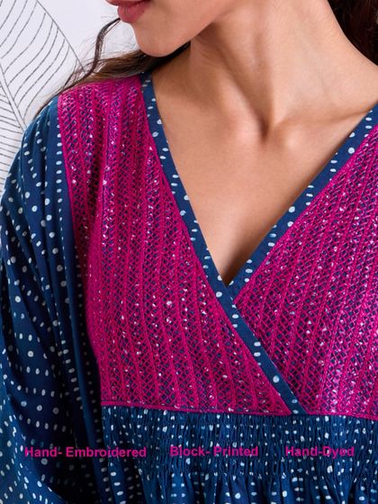 A close-up of the hand-embroidered and block-printed yoke on our Chaaya Indigo Dress. The combination of crafts creates a rich, textured look that is unique to our brand.