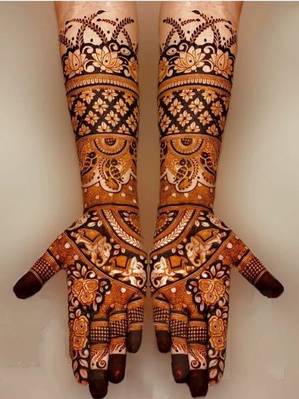 A beautiful symmetrical design featuring elephants and floral patterns. The use of negative space and bold lines gives this traditional design a modern feel.