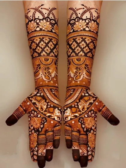 A beautiful symmetrical design featuring elephants and floral patterns. The use of negative space and bold lines gives this traditional design a modern feel.