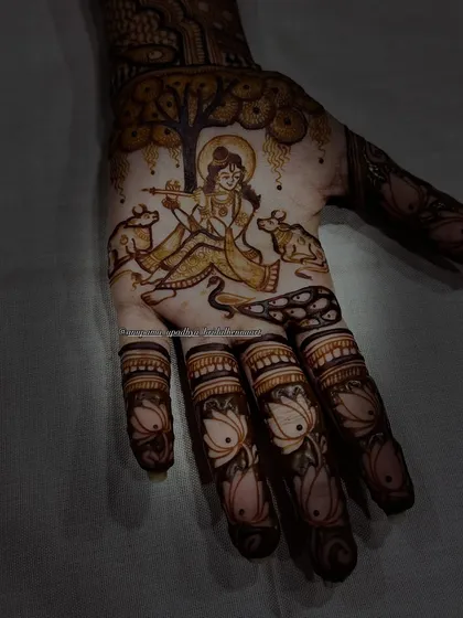 Another view of the divine Krishna design. The details of the cows and the tree create a serene and spiritual atmosphere on the palm.