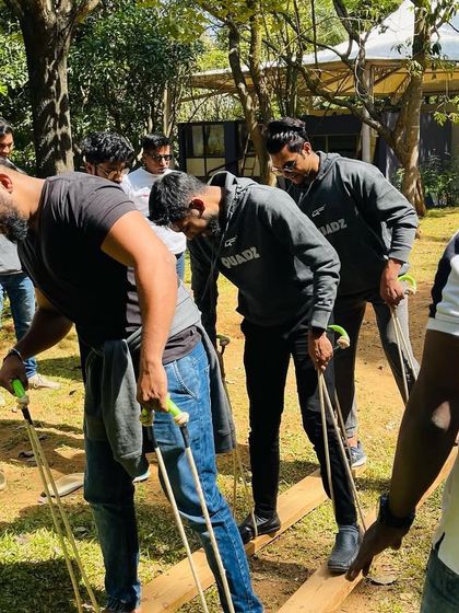 Team building is crucial for us. Here's a part of our team working together on a challenging outdoor activity during our recent team outing.