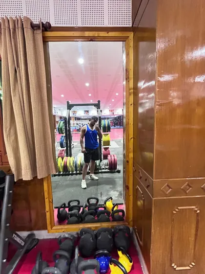 Another view of the training facility, showing the kettlebells and weight racks we use for our strength workouts.