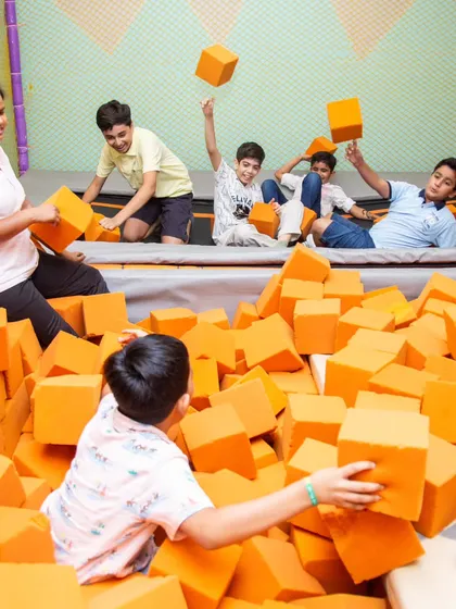 The energy is always high in our foam pit! It's part of our large, safe play zone where kids can jump, tumble, and play to their heart's content.