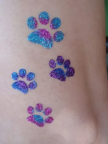 These paw print tattoos are a must-have for any Paw Patrol or animal-themed party. I use a mix of blue and purple glitter to make them extra vibrant.