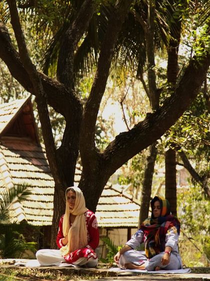 Guests meditating under the sacred Neem and Peepal trees on the auspicious occasion of Maha Shivaratri. These trees are known for their powerful healing and spiritual energy.