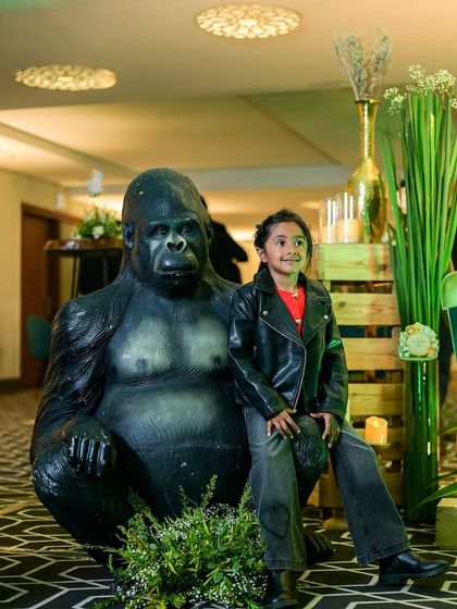 A little explorer enjoying his jungle themed party. We included life sized animal props like this gorilla to create a fun and interactive environment for the kids and a great photo opportunity.