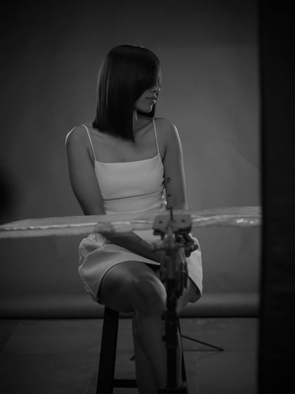 A candid black and white shot from behind the camera during our photoshoot for the sleek brunette look.