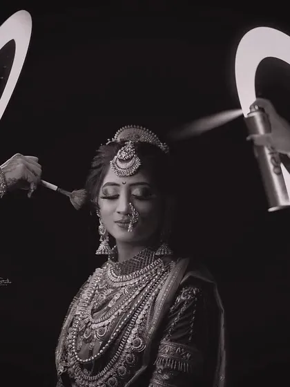 I also love creating unique, artistic portraits. This creative black and white shot uses ring lights to frame the bride during her makeup session, turning a behind-the-scenes moment into a piece of art.