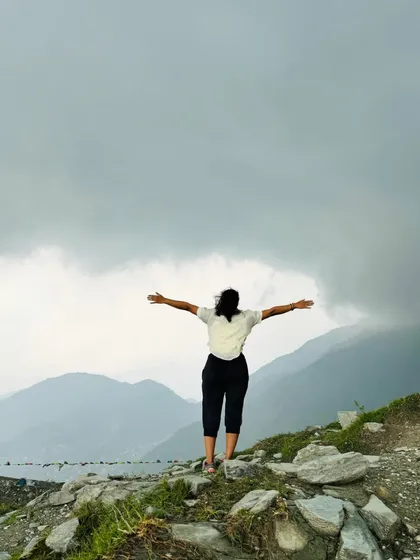 Spreading my arms to embrace the vastness of the mountains during my trek. These moments of peace and solitude are my way of recharging.