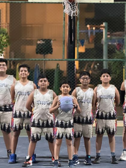 This group is ready to hit the court in their matching Warriors team uniforms.