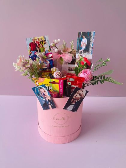The pink round box is a versatile option for any celebration. Here, it's customized for a birthday with photos and treats.