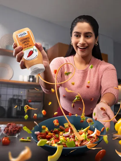 A clean version of the Veeba Southwest Chipotle sauce shot, focusing purely on the action and product. The swirling sauce and flying vegetables were meticulously captured to create a sense of movement and freshness.