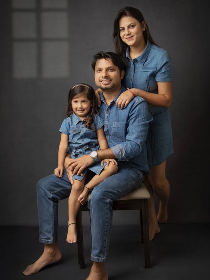 A formal family portrait in matching denim. This seated pose creates a classic, balanced composition that is perfect for a family heirloom.